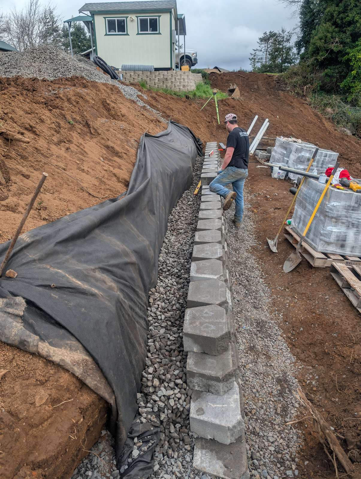 Curved Block Retaining Wall & Drainage - Retaining Walls / Drainage Solutions project in Coos Bay, Oregon (photo 1)